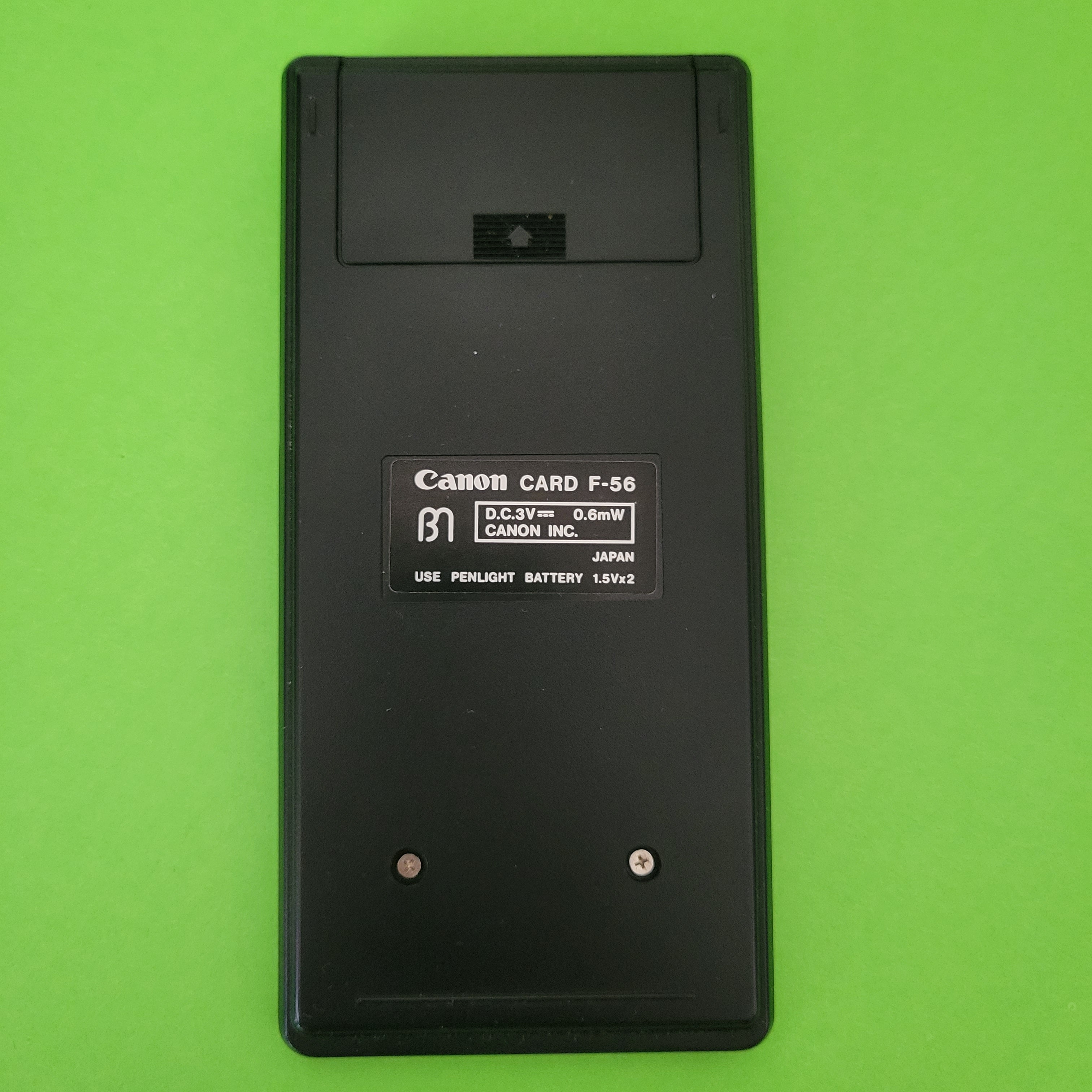 An image of the back of a canon card f-56 scientific/engineering calculator